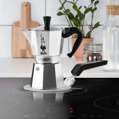 Placa adaptadora de inducción Bialetti con disco redondo blanco y asa negra
