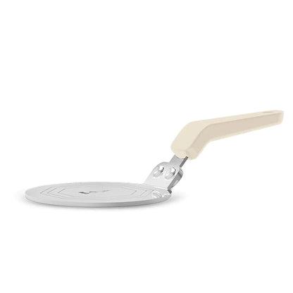 Placa adaptadora Bialetti de inducción, vista lateral con asa crema sobre disco