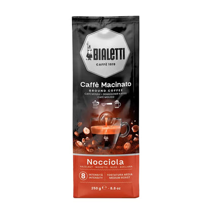 Bolsa de café molido Bialetti con avellanas, 250 g; fondo negro y franja roja.