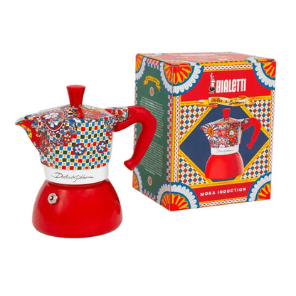 Cafetera moka roja de inducción con diseño multicolor y caja Bialetti Dolce&Gabbana