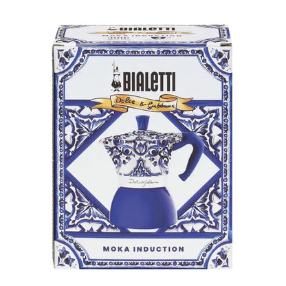 Caja de cafetera moka de inducción Bialetti azul y blanca con motivo Dolce&Gabbana.