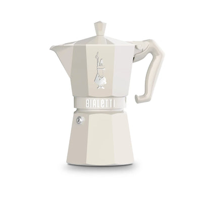 Cafetera moka Bialetti color crema con asa, cuerpo en dos secciones.