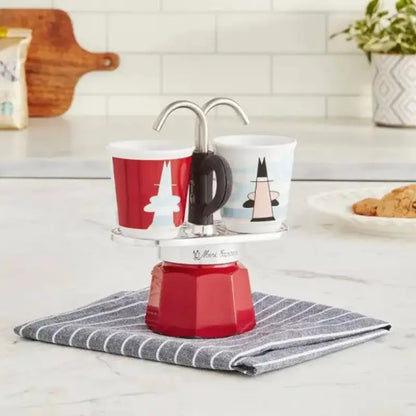 Cafetera moka Mini Express Bialetti roja con 2 vasos blanco y rojo