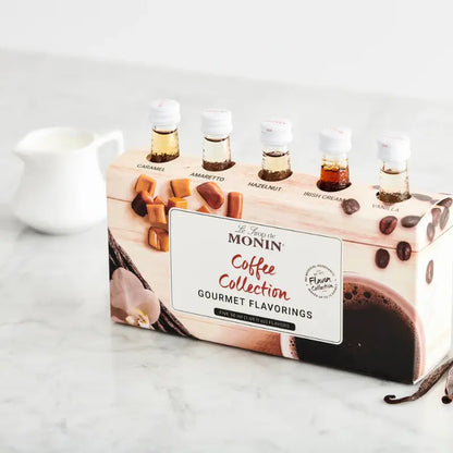 Set de jarabes MONIN Coffee Collection con 5 botellitas y caja frontal con etiqueta