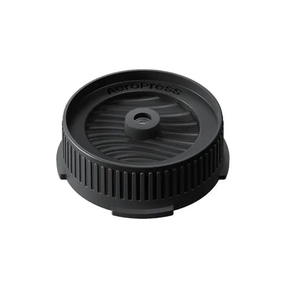 Tapa negra circular para portafiltro Aeropress, con control de flujo