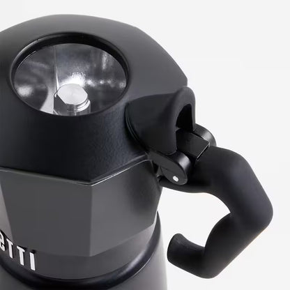 Cafetera Bialetti Brikka noir: tapa circular y válvula, asa lateral