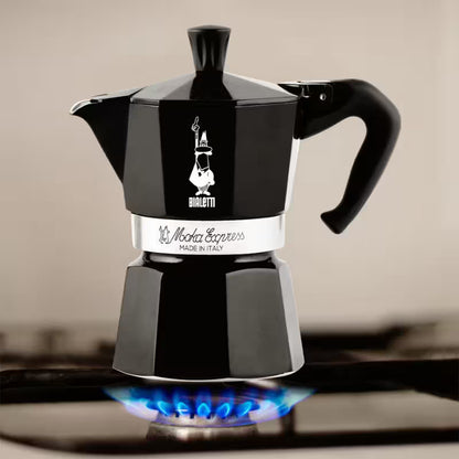 Cafetera moka italiana Bialetti negra con tapa superior y base metálica