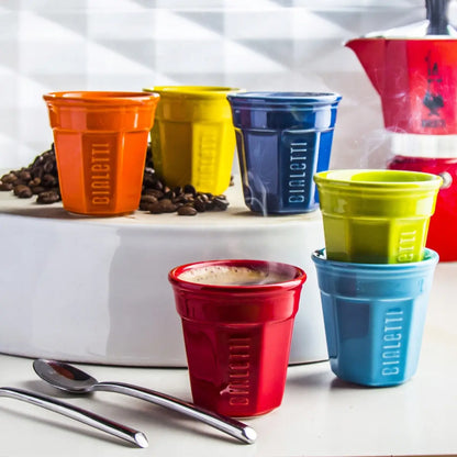 Set de 6 vasos de cerámica para espresso con vasos en naranja, amarillo, azul y rojo.