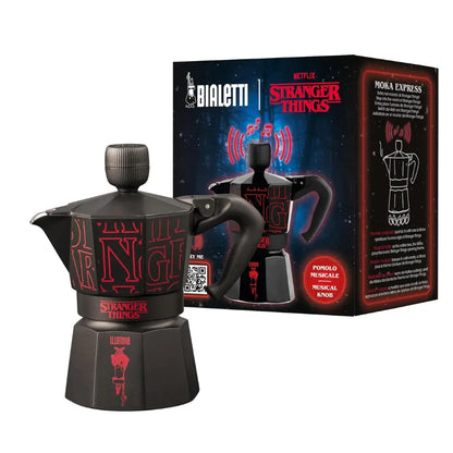 Cafetera moka negra Stranger Things y caja con ilustración roja, Bialetti.