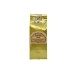 Vista vertical de la bolsita dorada de té Sensorial «Flora». El paquete contiene té negro, flores de malva, rosa y pétalos de peonía.
