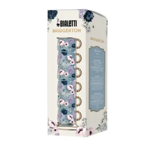 Caja del elegante juego de 6 tazas de espresso apiladas, con delicados motivos florales y detalles dorados, inspirado en la serie Bridgerton.